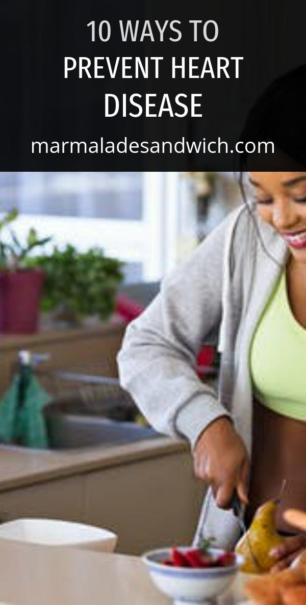 Woman preparing fruit and vegetables as part of a healthy diet to prevent heart disease